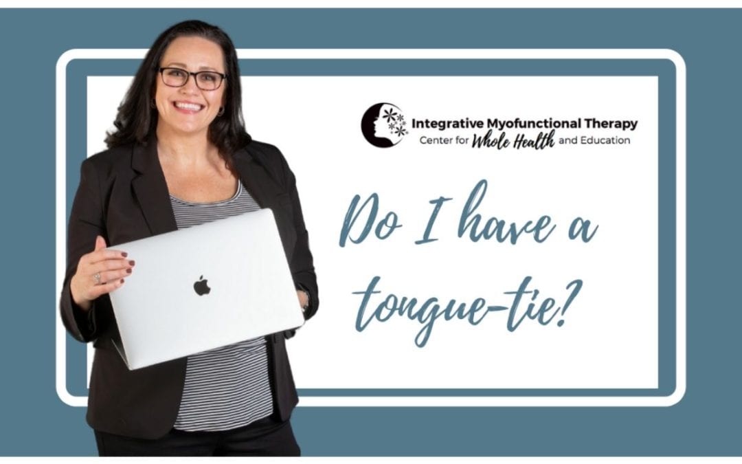 Carmen Woodland with a laptop teaching Do I have a tongue-tie.